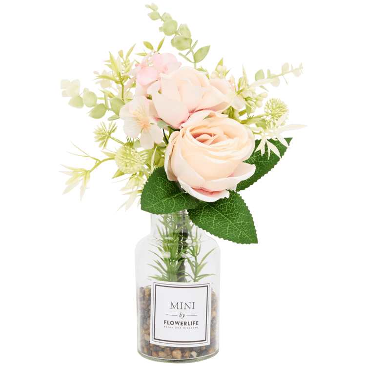 Künstliche Blumen in Glasflasche